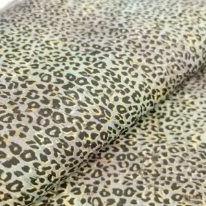 This is a leopard printed pattern on cork fabric