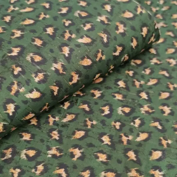 This is a leopard printed pattern on cork fabric