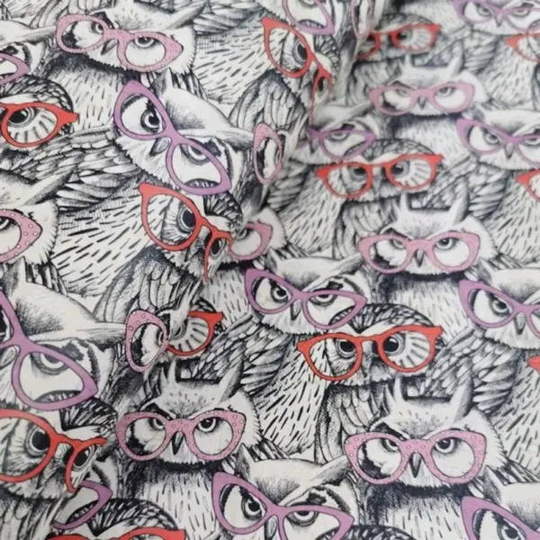 This is a owl printed pattern on cork fabric