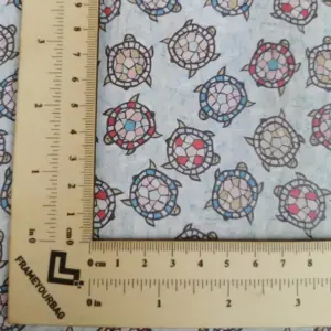 This is a turtles printed pattern on cork fabric