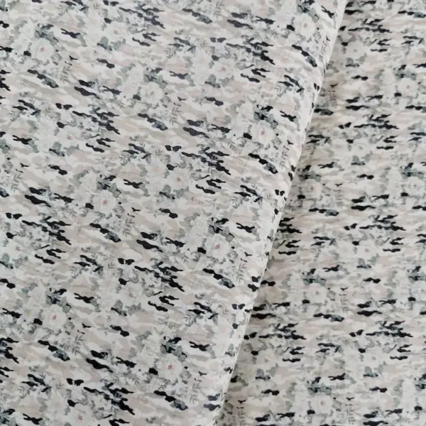 This is a camouflage printed pattern on cork fabric