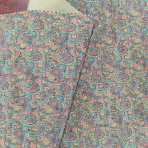 This is a paisley printed pattern on cork fabric