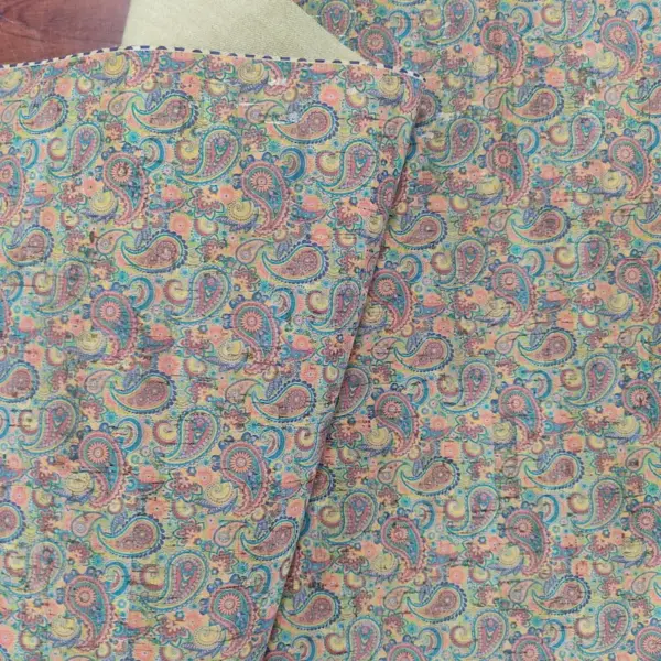 This is a paisley printed pattern on cork fabric