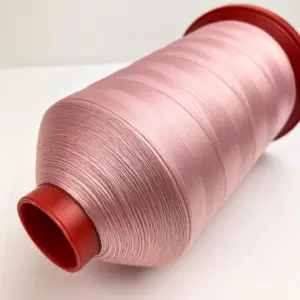 This is a light pink polyester sewing thread