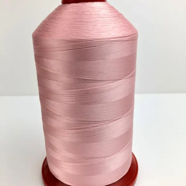 This is a light pink polyester sewing thread